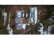 An aerial view showcases the modern home's unique layout with solar panels and outdoor living spaces at 2536 N State Highway 67, Sedalia, CO 80135