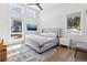 Bright bedroom with large windows, wood floors, and a nature view at 2536 N State Highway 67, Sedalia, CO 80135