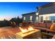 Relaxing deck with fire pit and comfortable seating overlooks a scenic view at 2536 N State Highway 67, Sedalia, CO 80135