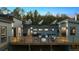 A rear exterior shows a large wooden deck with an outdoor seating area and grill at 2536 N State Highway 67, Sedalia, CO 80135