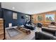 Well-equipped home gym with modern exercise machines, wooden accent walls, and natural light at 2536 N State Highway 67, Sedalia, CO 80135