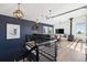 Modern living room with a view, featuring a fireplace, a large island, and hardwood floors at 2536 N State Highway 67, Sedalia, CO 80135