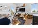 Bright living room with cozy seating, wooden accents, and large windows framing scenic views at 2536 N State Highway 67, Sedalia, CO 80135