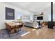 Inviting living room with comfortable seating, modern decor, and a cozy fireplace at 2536 N State Highway 67, Sedalia, CO 80135