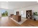 Bright office space featuring a large desk, built-in bookshelves, and sliding glass doors leading to the outdoors at 2536 N State Highway 67, Sedalia, CO 80135