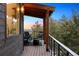 Outdoor patio with comfortable seating, providing scenic views of the forest and a colorful sky at 2536 N State Highway 67, Sedalia, CO 80135