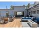 Spacious outdoor patio featuring a seating area, a fire pit, and access to the home's interior at 2536 N State Highway 67, Sedalia, CO 80135