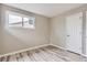 Bedroom with wood-look flooring and fresh paint at 4624 W Virginia Ave, Denver, CO 80219