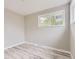 Cozy bedroom featuring fresh gray paint and attractive, light gray floors at 4624 W Virginia Ave, Denver, CO 80219