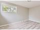 Bedroom featuring new windows and wood-look floors at 4624 W Virginia Ave, Denver, CO 80219