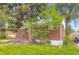 Charming brick house with mature trees adding shade and character to the exterior at 4624 W Virginia Ave, Denver, CO 80219