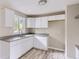 Bright kitchen showcasing white cabinets and new fixtures, designed for functionality and style at 4624 W Virginia Ave, Denver, CO 80219