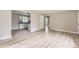 Open-concept living space with updated flooring, neutral walls, and seamless transition to the kitchen at 4624 W Virginia Ave, Denver, CO 80219