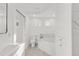 Spa-like bathroom features a soaking tub, toilet and updated vanity at 1669 S Lincoln St, Denver, CO 80210