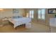 Sunny bedroom featuring two windows, comfortable furnishings and neutral tones at 10451 Truckee St # 2D, Commerce City, CO 80022