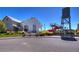 Community building with a unique water tower feature, visible from the street at 10451 Truckee St # 2D, Commerce City, CO 80022