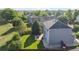 Aerial view of the property highlighting the backyard, mature trees, and the surrounding neighborhood at 7977 Emerson Ave, Frederick, CO 80530