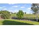 Picturesque backyard with a wood fence and beautiful views of neighboring houses and lush open fields at 7977 Emerson Ave, Frederick, CO 80530