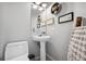 Charming powder room features modern fixtures and decor at 7977 Emerson Ave, Frederick, CO 80530