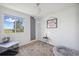 Bedroom with a large window showing field and sky, fun moon decor, and neutral-toned rug at 7977 Emerson Ave, Frederick, CO 80530
