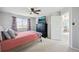 Cozy bedroom with a modern ceiling fan at 7977 Emerson Ave, Frederick, CO 80530