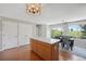 Dining area next to the kitchen features an island and access to the outdoor space at 7977 Emerson Ave, Frederick, CO 80530
