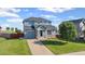 Charming two-story home with blue siding, a well-maintained lawn, and an attached one car garage at 7977 Emerson Ave, Frederick, CO 80530