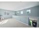 Spacious loft area with ample natural light and neutral carpeting at 7977 Emerson Ave, Frederick, CO 80530