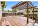 Spacious backyard deck featuring a pergola, bench seating, and a well-maintained fence at 3321 Stuart St, Denver, CO 80212