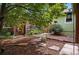 Backyard featuring mature shade tree, wood fence and a variety of greenery at 3321 Stuart St, Denver, CO 80212