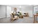 Cozy basement living room features neutral decor, plush carpet, and ample seating at 3321 Stuart St, Denver, CO 80212