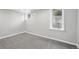 Finished basement room with plush carpet, neutral paint, and natural light at 3321 Stuart St, Denver, CO 80212