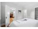 View of the bedroom with a doorway to a living area with a fireplace and to a closet at 3321 Stuart St, Denver, CO 80212