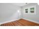 Bright bedroom featuring hardwood floors, a double-hung window, and a closet at 3321 Stuart St, Denver, CO 80212