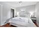 Bright bedroom featuring white walls, wood floors, ceiling fan, and ample natural light from the window at 3321 Stuart St, Denver, CO 80212