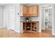 Bright open floorplan with built-in corner bar cabinet and view of bathroom at 3321 Stuart St, Denver, CO 80212