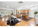 Open-concept living and dining area with hardwood floors and a well-equipped kitchen at 3321 Stuart St, Denver, CO 80212