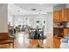 Bright open-concept living and dining area featuring hardwood floors at 3321 Stuart St, Denver, CO 80212