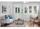 Bright living room with hardwood floors, a large window, and neutral modern decor at 3321 Stuart St, Denver, CO 80212