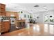 Bright open floorplan kitchen, dining area, and french doors to outdoor patio at 3321 Stuart St, Denver, CO 80212