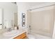 Bathroom with a combined shower and tub and white single sink vanity at 9852 E Idaho St, Aurora, CO 80247