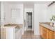 Bright bathroom featuring tiled floors, double sinks, and a separate area for the bathtub at 9852 E Idaho St, Aurora, CO 80247