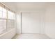 Bedroom with neutral carpet, window with shade and sliding closet doors at 9852 E Idaho St, Aurora, CO 80247