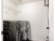 Convenient laundry room with modern washer and dryer, plus wire shelving for storage at 9852 E Idaho St, Aurora, CO 80247