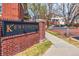 Elegant community signage with brick pillars, indicating the entrance to Kensington at 9852 E Idaho St, Aurora, CO 80247