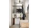 Open staircase with black railing leading to dining area with modern furnishings at 9852 E Idaho St, Aurora, CO 80247