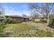 Spacious backyard of home featuring mature trees and ample space at 4102 W Eastman Ave, Denver, CO 80236
