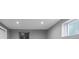 Finished basement area with two windows and access to a storage closet at 4102 W Eastman Ave, Denver, CO 80236
