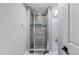 Bathroom featuring a glass enclosed stand up shower with stone flooring at 4102 W Eastman Ave, Denver, CO 80236