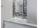 Stylish bathroom with a vessel sink, marble countertop, and designer tile backsplash at 4102 W Eastman Ave, Denver, CO 80236